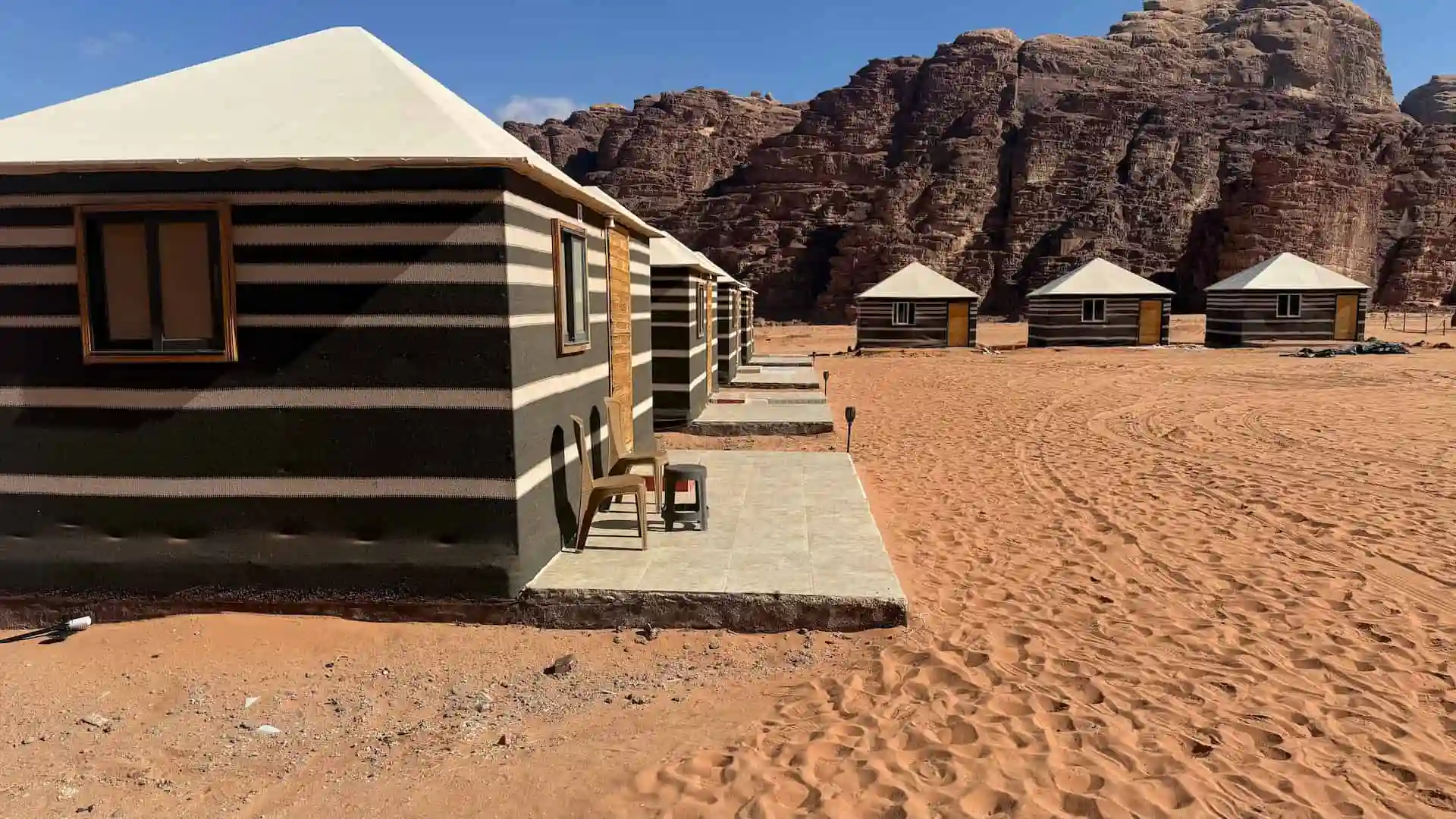 Majestic view of Wadi Rum Desert Stars luxury tents nestled against red sandstone mountains
